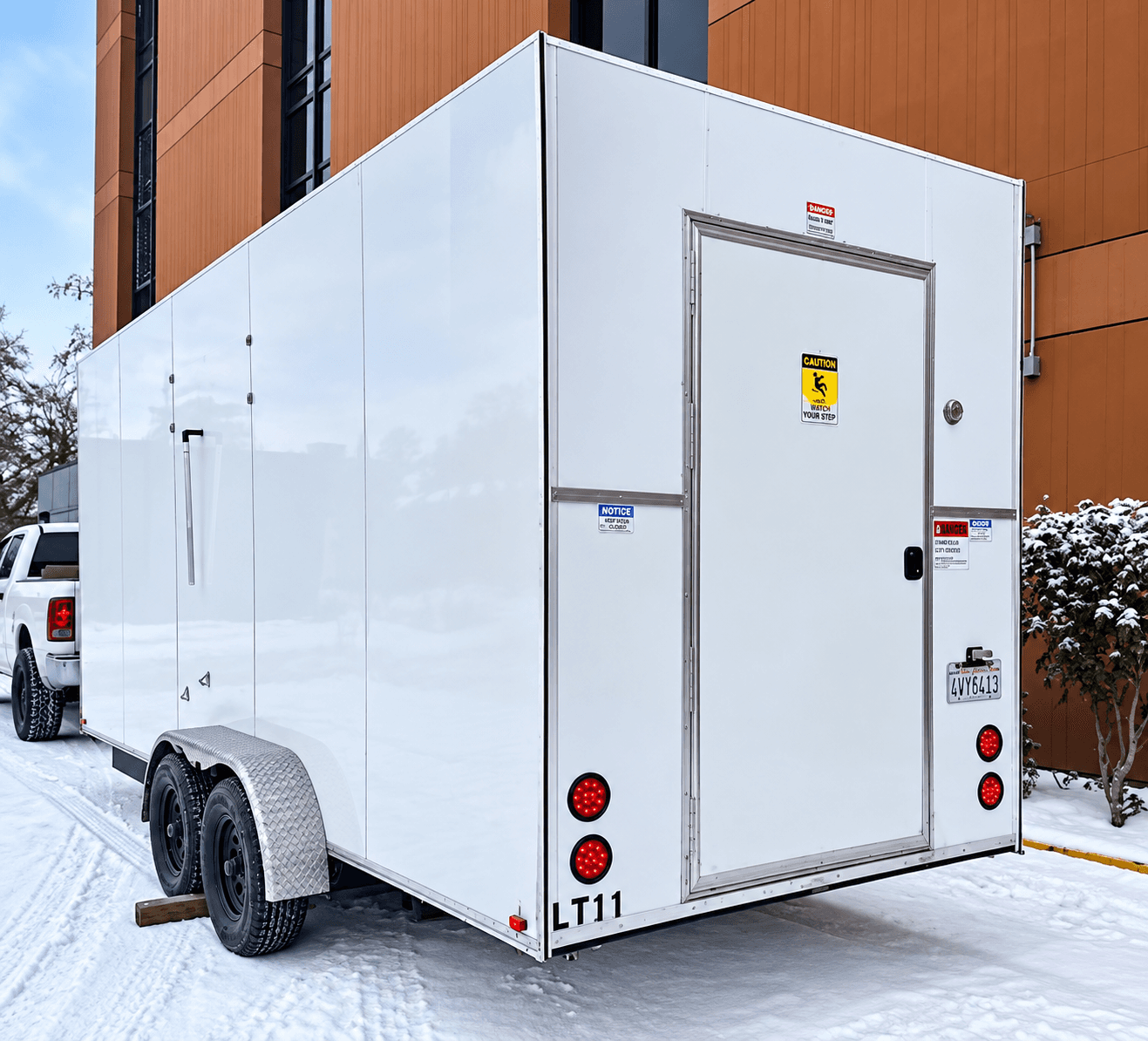 White refrigerated trailer viewed from the rear and side