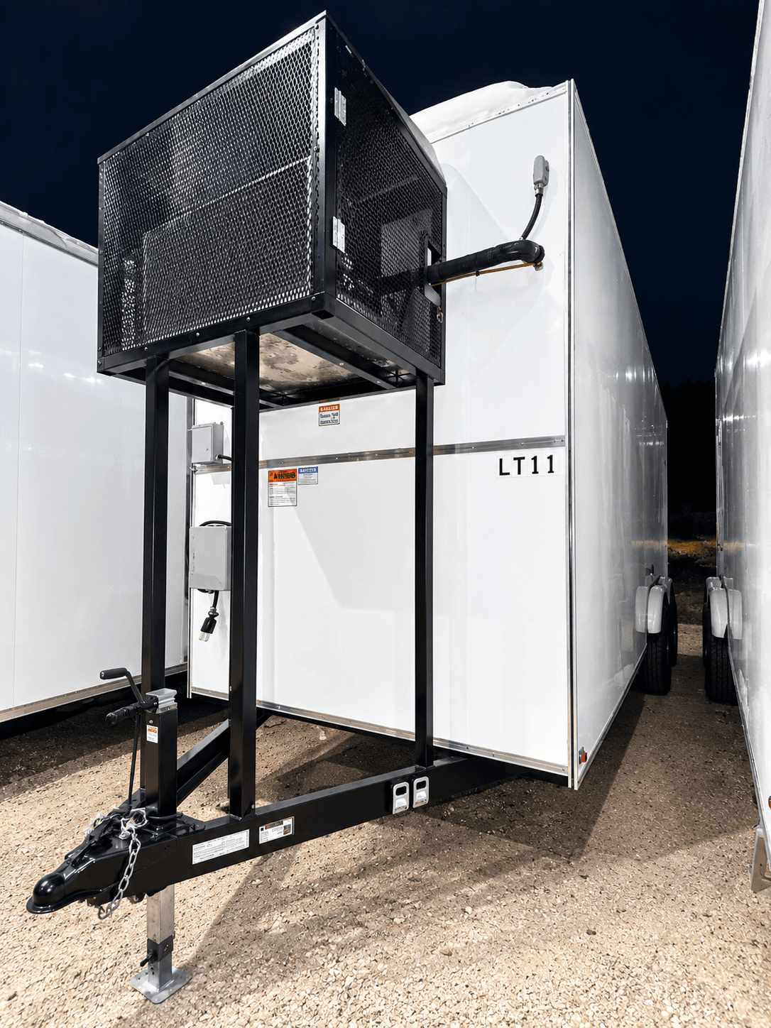 Front-mounted refrigeration unit and hitch on a white trailer